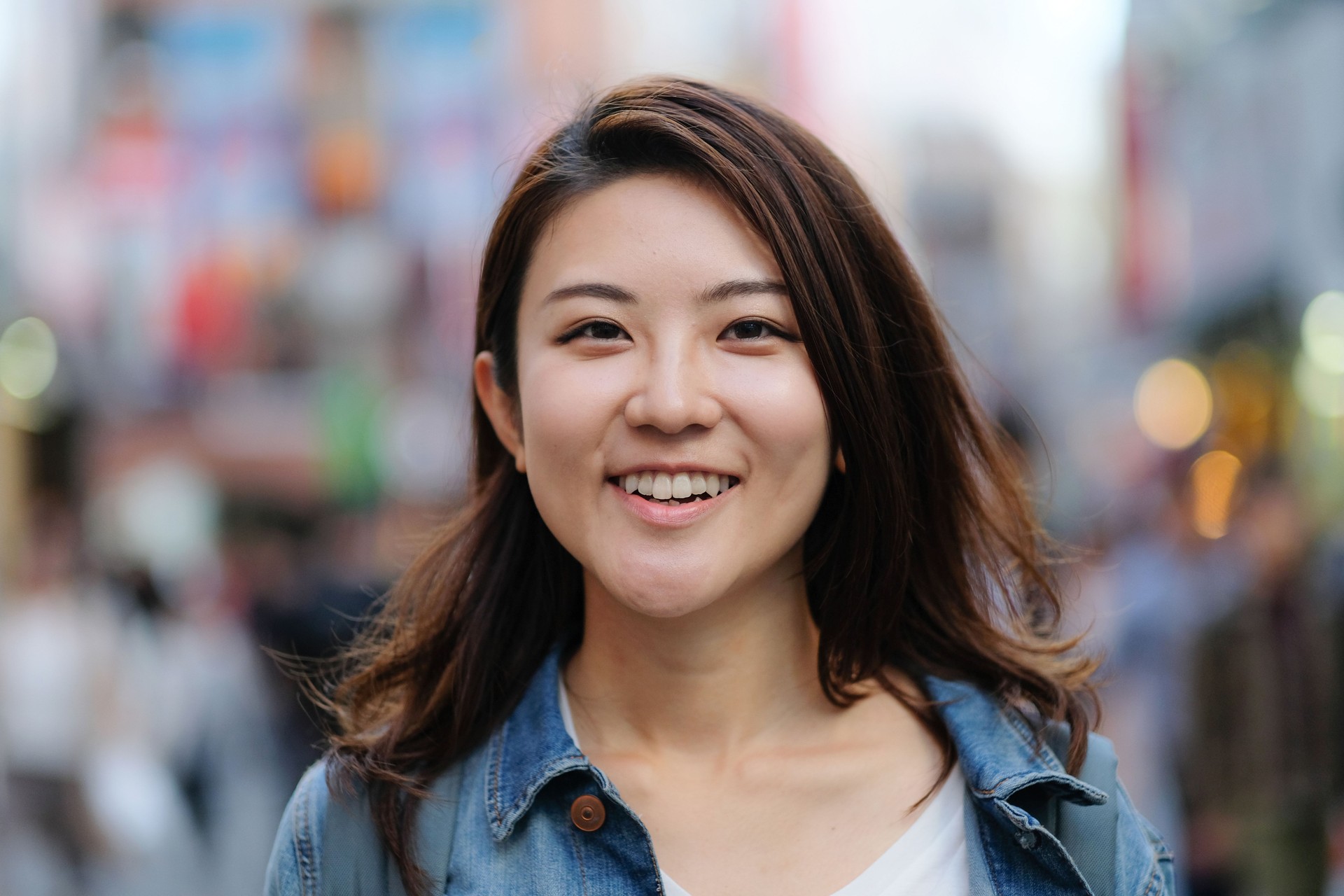 Portrait of young woman on street